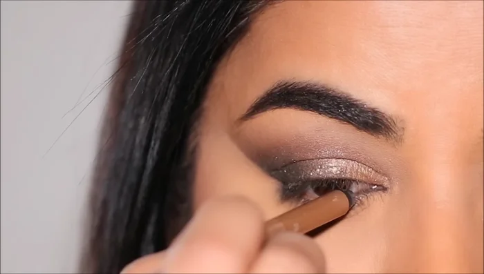 Apply eyeliner (remel scandalized pencil in Hypnotic Gold in the waterline and Urban Decay liquid liner in Black for a small wing).