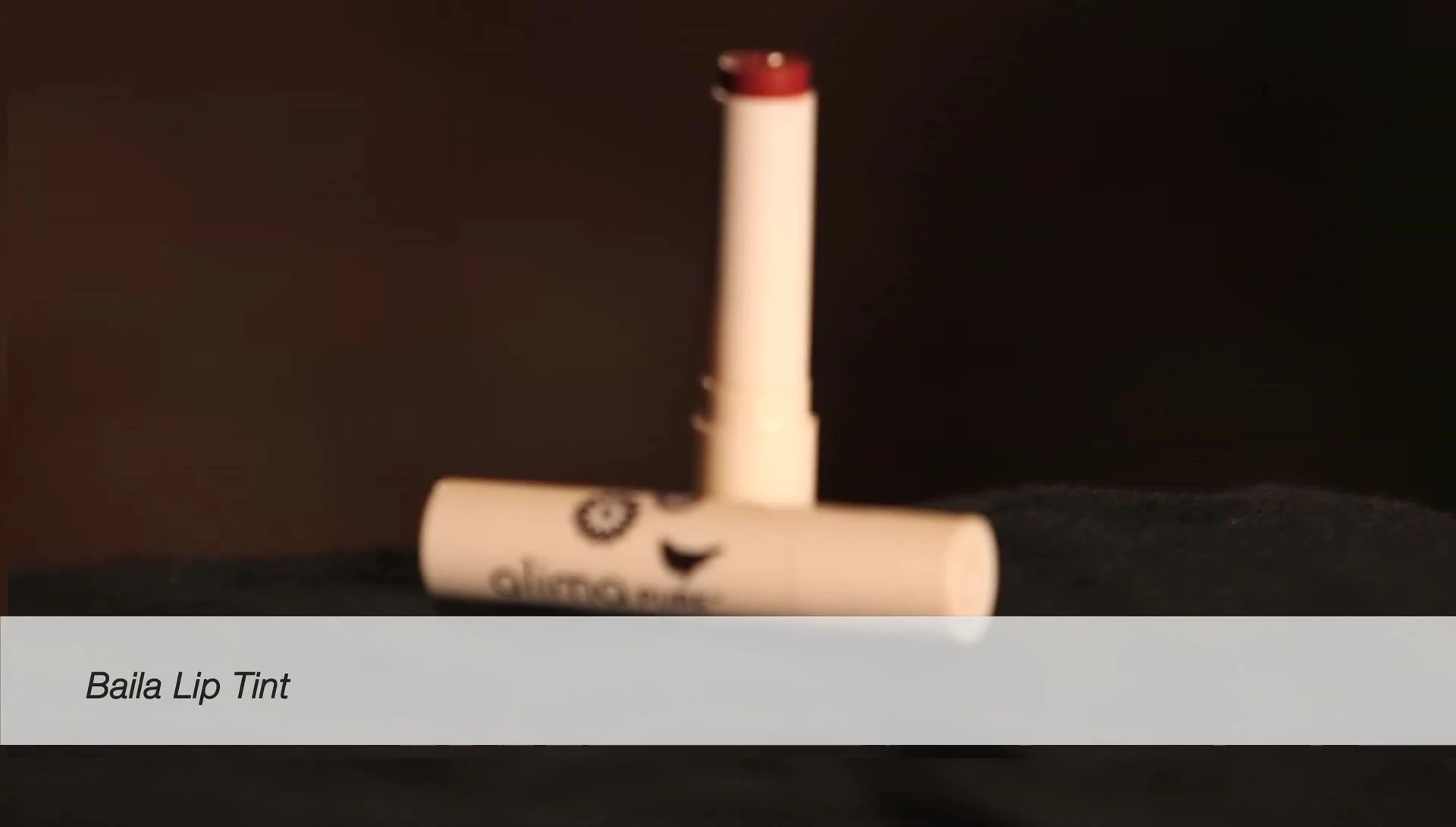 Applying Baila lipstick