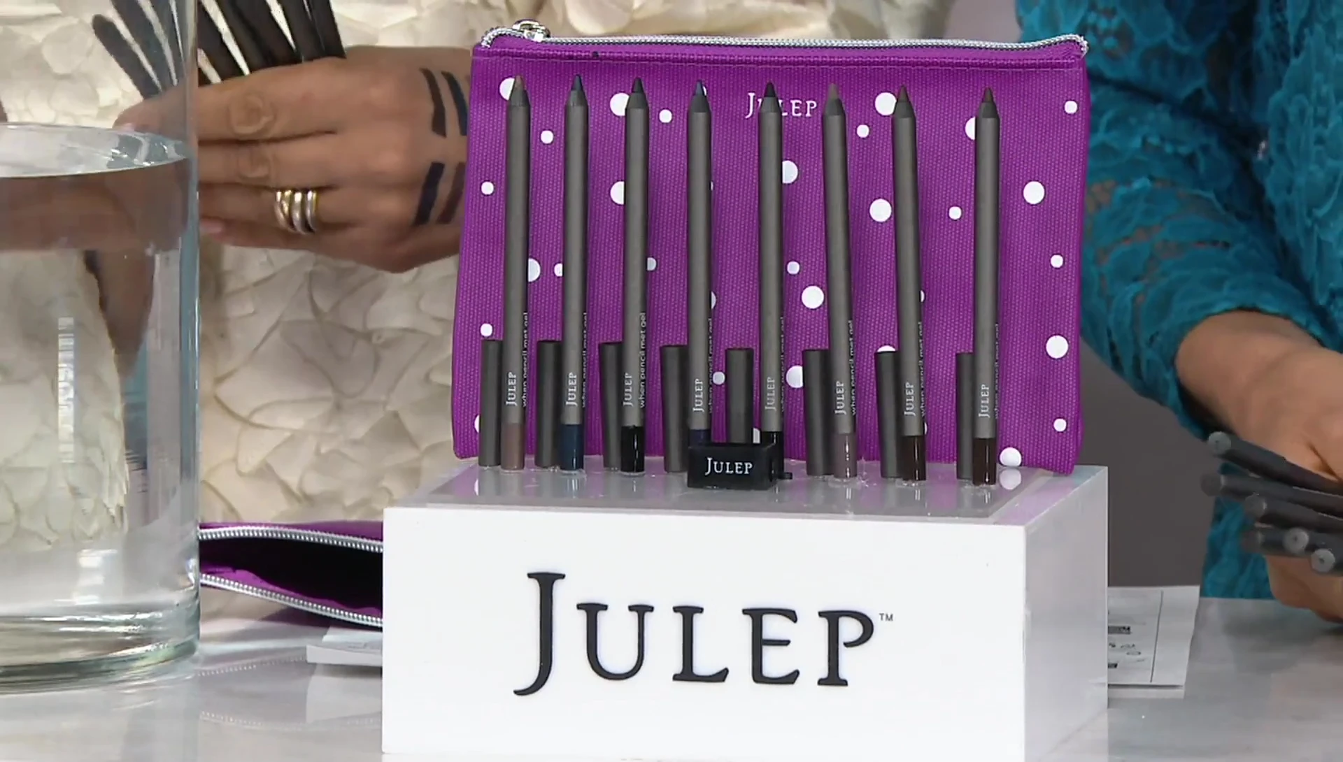 Host showing the discounted price of the eyeliner set.