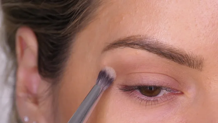 Use a smaller blending brush for smaller lids or more precise blending in the socket line.