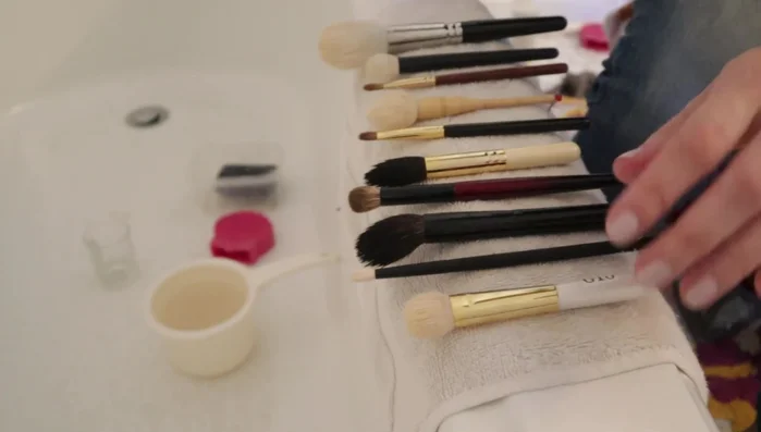 Reshape the brush and lay it flat to dry, ensuring it's not touching any surface.