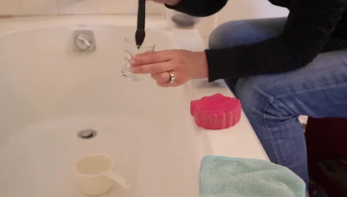 Gently swirl the brush on the cleaner to remove makeup residue.