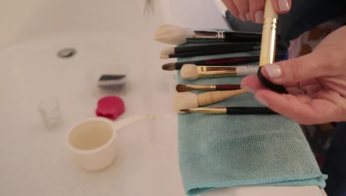 Reshape the brush and lay it flat to dry, ensuring it's not touching any surface.