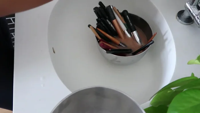 Use a makeup brush scrubber to clean each brush individually.