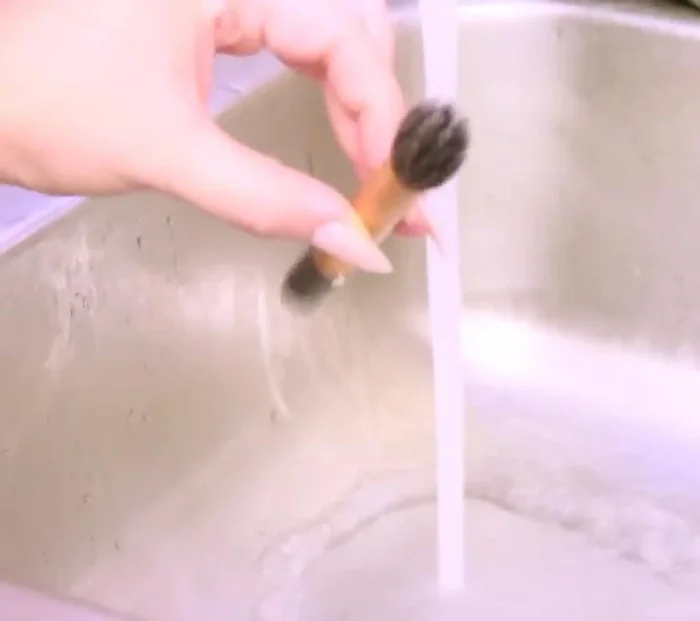 Reshape the brushes and lay them flat to dry, ideally using a brush guard or wrapping the handles with paper towels to absorb excess water and prevent lint from sticking.