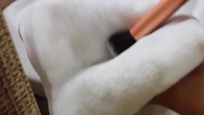 Swirl brushes in a cream or paper towel to absorb more water.