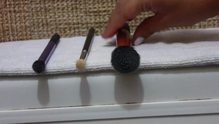 Lay brushes flat at a 360° angle to air dry (or use a blow dryer on medium heat, aiming in the direction of hair growth).