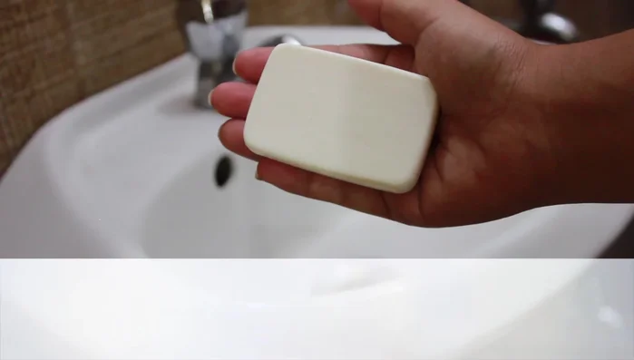 Rinse thoroughly under running tap water, rubbing on hands to remove all lather.