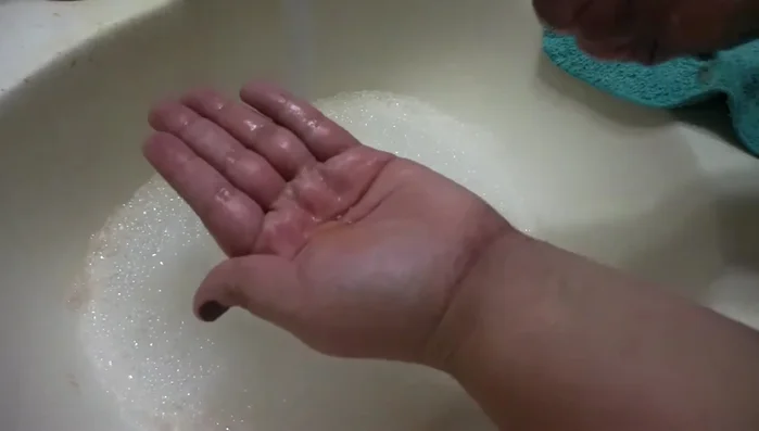 Add a small amount of baby shampoo to the brush.