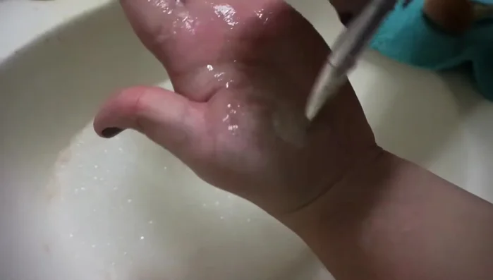 Swirl the brush with your fingertips, moving upwards to prevent transferring dirt into the shampoo.