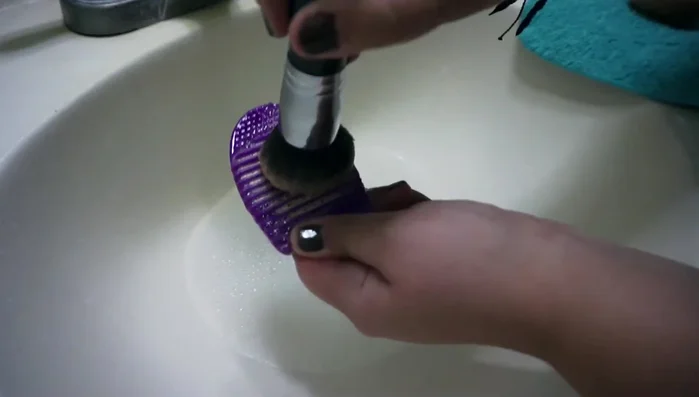 Swirl the brush on the sponge until it becomes frothy.