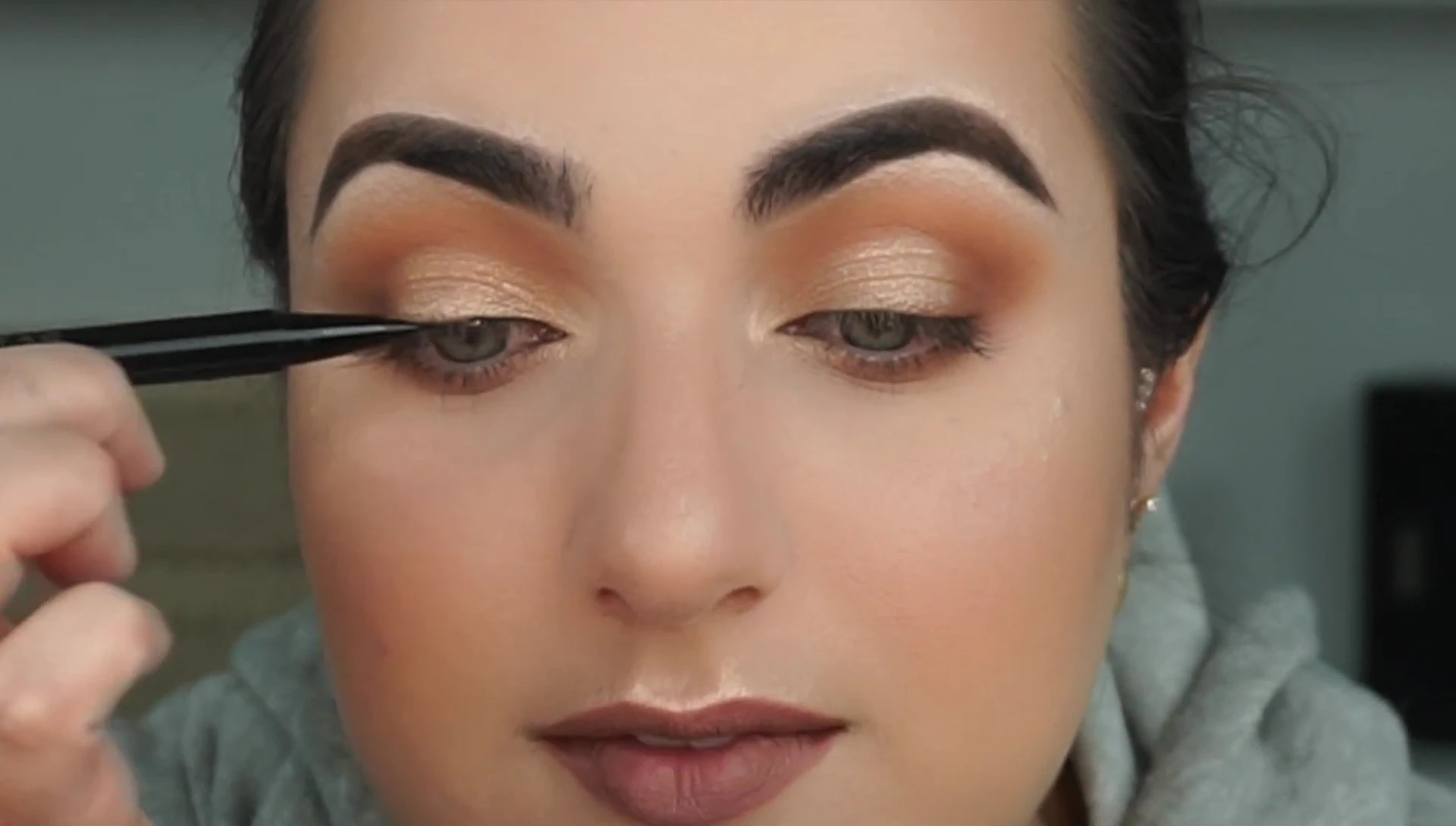 The reviewer applying the eyeliner for the first time.