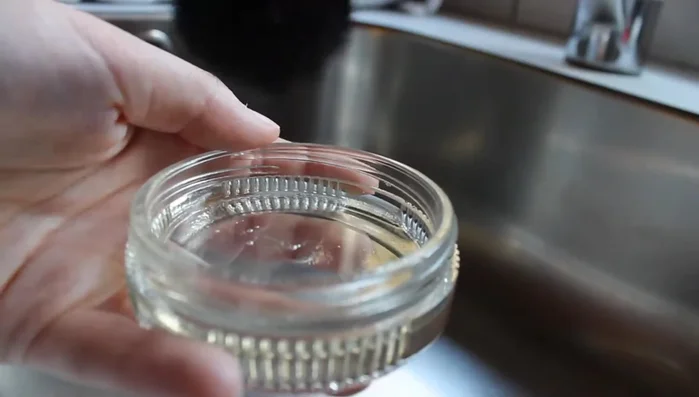 Dip the brush into the shampoo, then into the water.