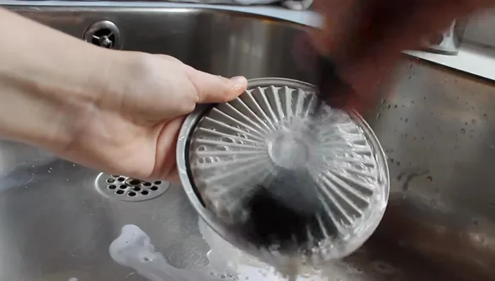 Run the brush under water while swirling.