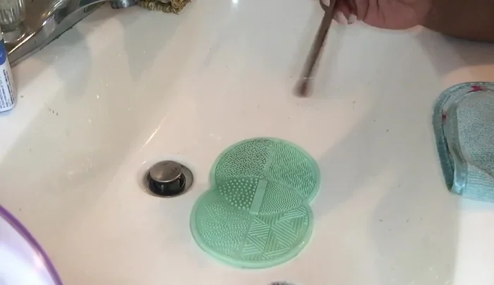 Clean other brushes (e.g., highlighter, powder brushes) using the same method, adjusting the scrubbing intensity as needed.
