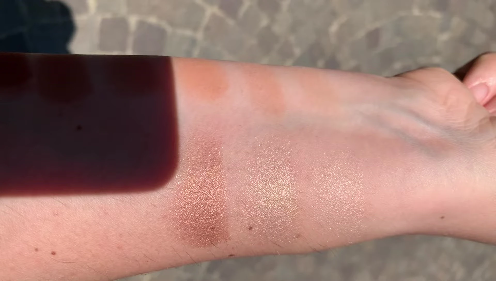 Highlighter swatches under direct sunlight