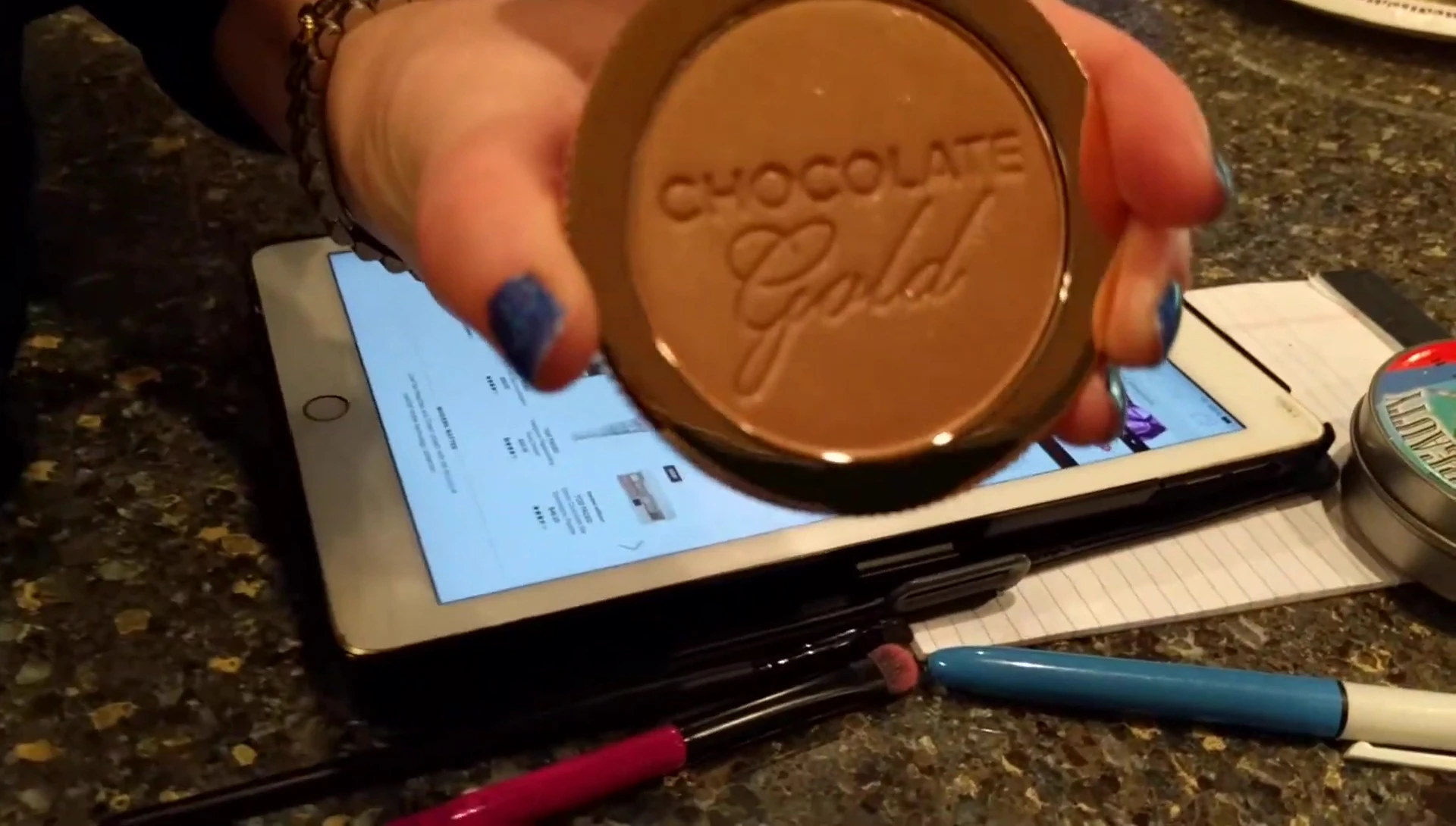 A shot showing the bronzer in the compact with its luxurious appearance.