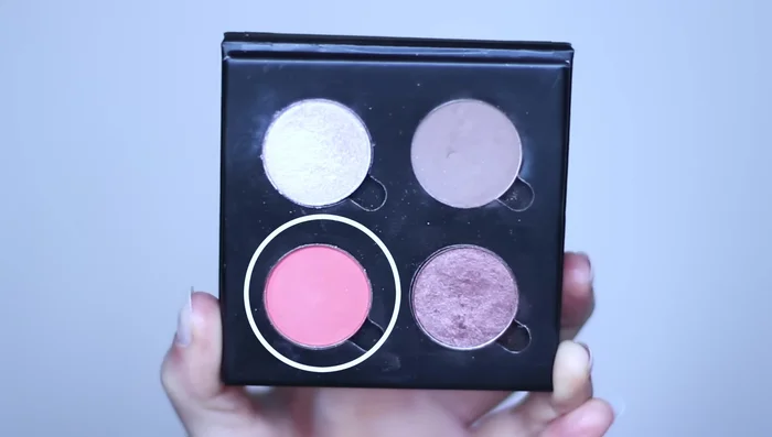 Apply fade shade to blend the highlight and contour, creating a seamless transition. Blend into the crease as well.