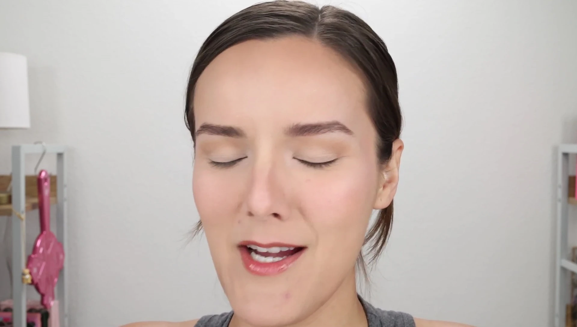 The YouTuber reacting to the intense spray.