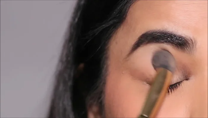 Prime your lids with an eye primer and set it with translucent powder to create a smooth base.