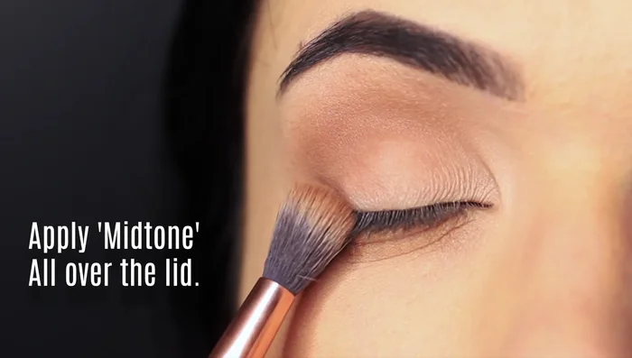 Apply the mid-tone shade across the lid from the crease to the lash line.
