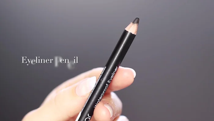 Apply black eyeliner to your upper waterline (tightline).