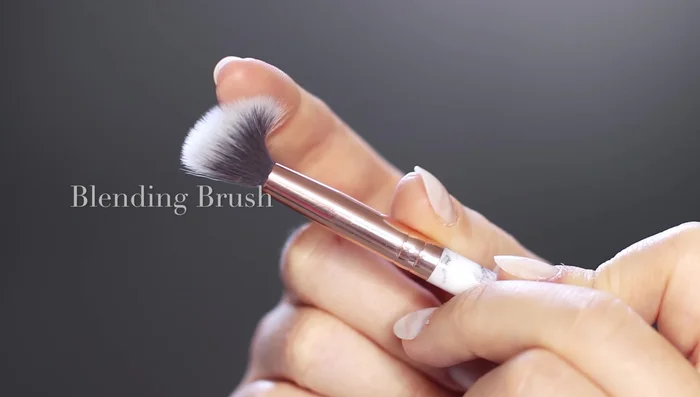 Apply the lightest shade (highlighter) all over the lid using a blending brush. This sets your base and helps with blending.