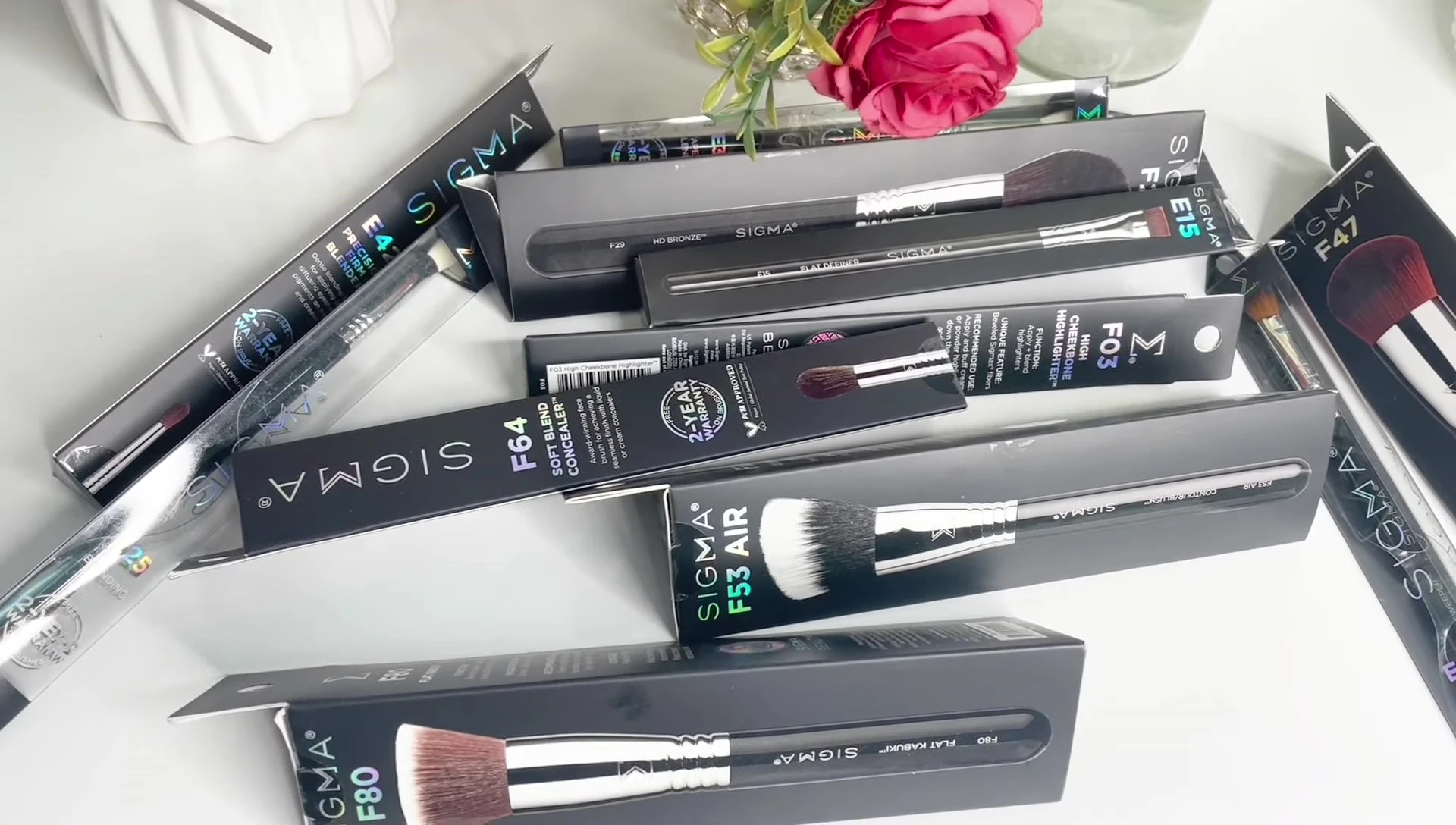 Close-up of a Sigma Beauty brush showcasing its handle and bristles.