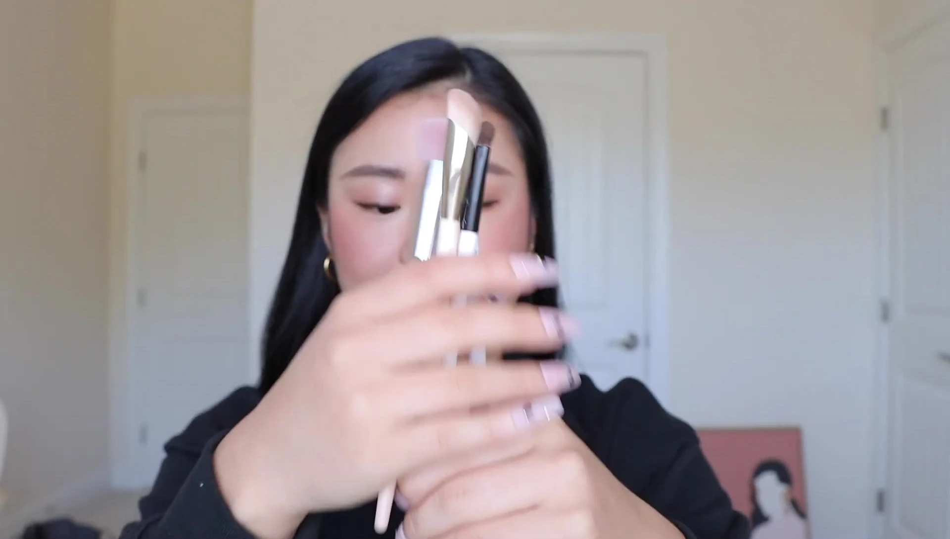 Close-up of the speaker's high-end makeup brushes