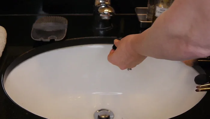 Let it sit: Allow the cleanser to sit on the brushes for 1-2 minutes to dissolve the makeup.