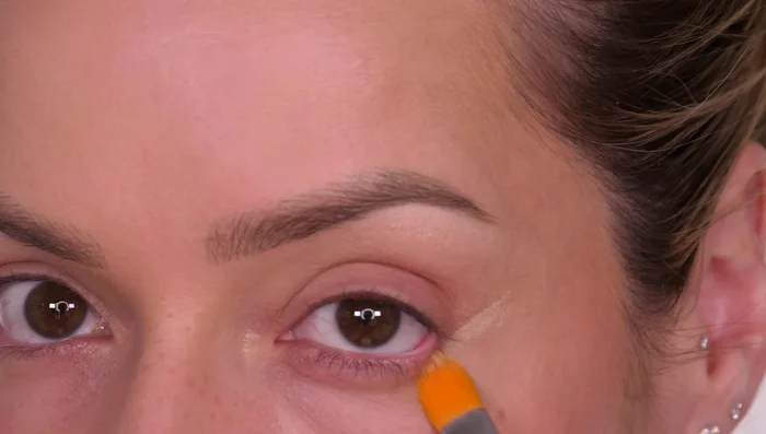 Apply concealer to the outer corner of your eye, following the lower lash line upwards towards your temple, to create fullness and a lifted appearance.