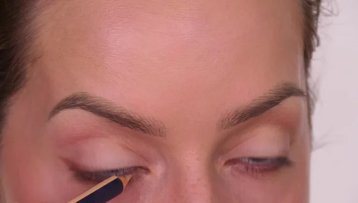 Apply a cream or flesh-toned pencil along your waterline to make the eye appear larger.