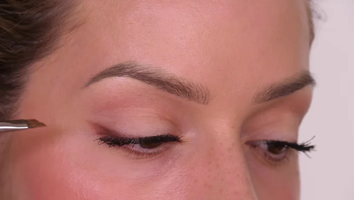 Apply a few individual lashes to the outer third of your lash line for extra lift and definition.