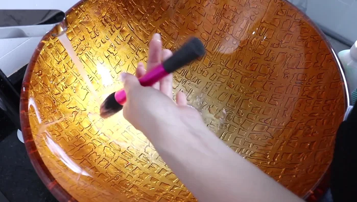 Wet your brush. Do not soak your brushes in water to avoid damaging the glue that holds the bristles together.